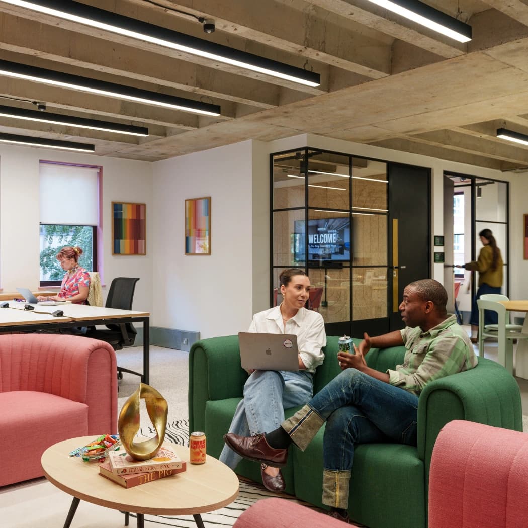 Coworkers using the new space